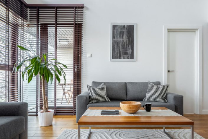 Modern Living Room With Floor To Ceiling Glass